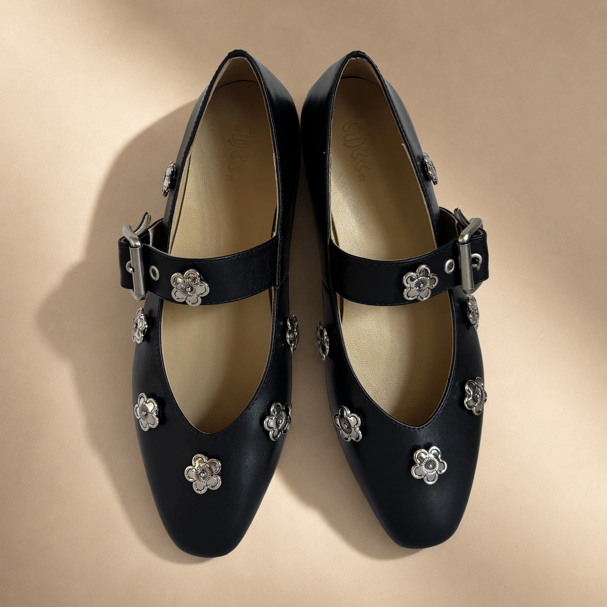 Black shoes with silver floral embellishments #silver